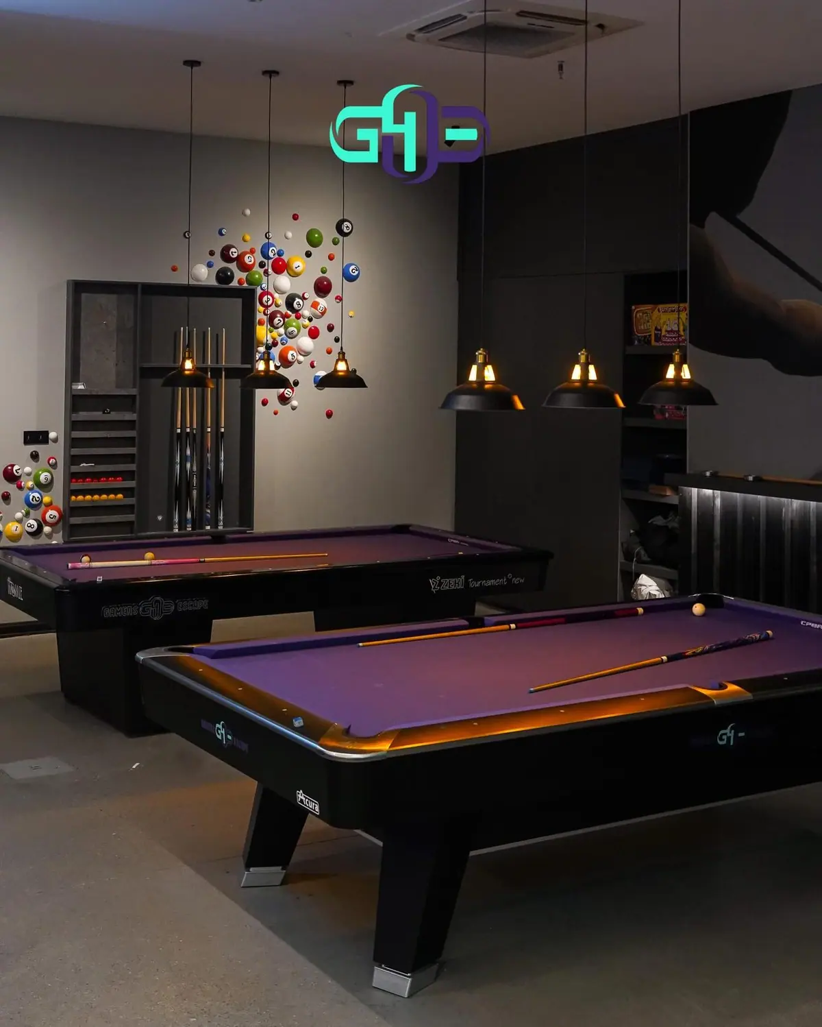 Gamers Escape lounge interior with neon lighting and pool tables